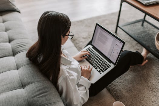 A woman browsing job openings on a laptop