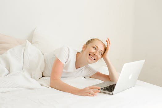 woman smiling with her laptop