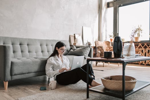 image of a woman coding on her laptop