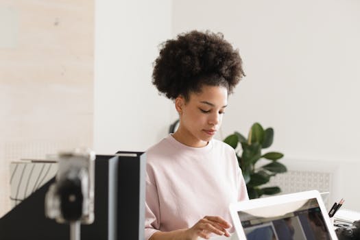 a woman meditating at her desk