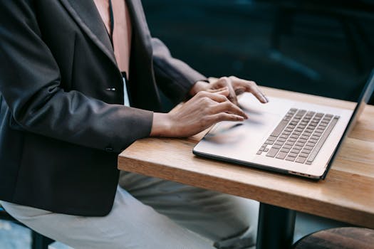 woman using a computer to manage projects